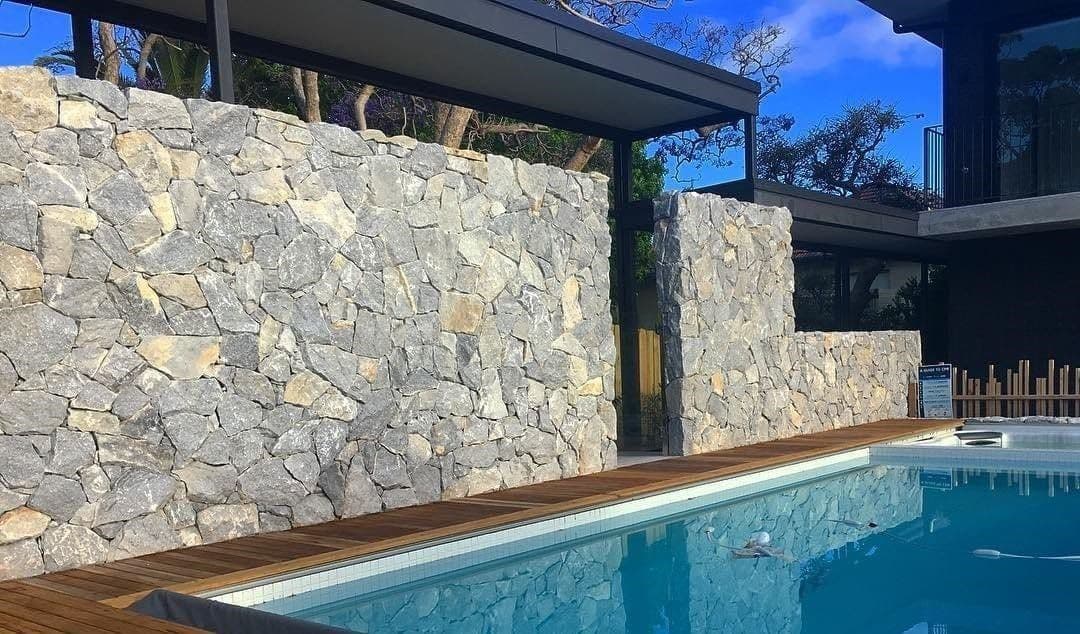 Ironbark natural stone on a pool wall